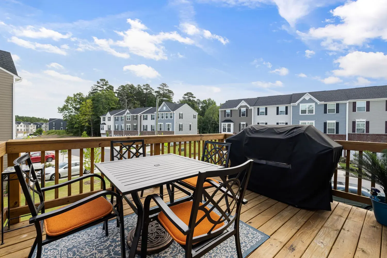 Deck painting in Marietta, GA: backyard deck with table, chairs and a freshly coated surface